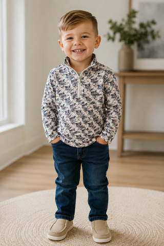 Little boy wearing the mallard shirt. 