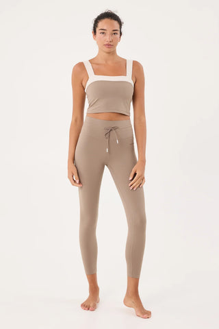 Women wearing workout clothes.