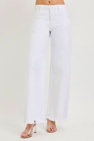 White jeans worn by a person on a white background