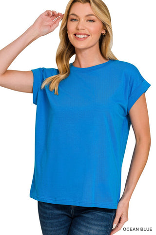 Woman wearing a blue t-shirt with 'Ocean Blue' label on a white background