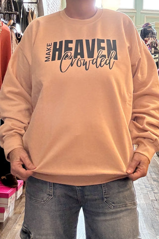 Person wearing a beige sweatshirt with text in a store setting