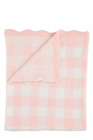 Pink and white checkered blanket on a white background