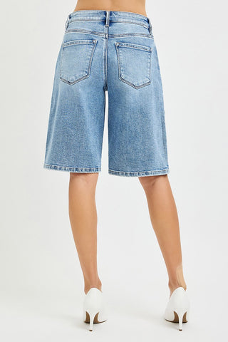Light blue denim shorts worn by a person on a white background