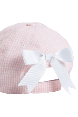 Pink checkered baby hat with a white bow on a white background