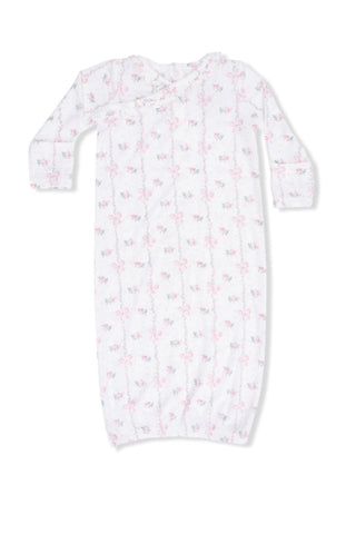 White baby onesie with pink floral pattern on a white background