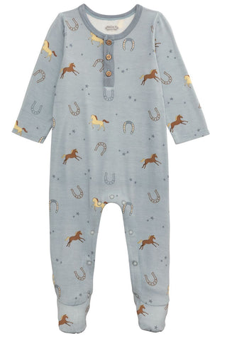 Children's onesie with horse and horseshoe pattern on a light blue background