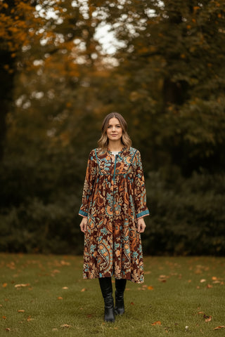 women in long sleeve bohemian dress outside