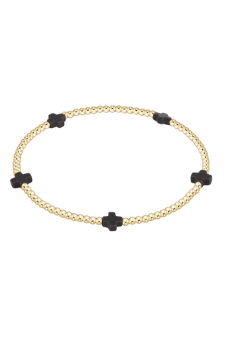 gold bracelet with black cross beads