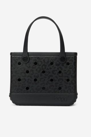 A black Crocboxy tote bag with a perforated textured front panel and a single top handle, shown against a plain light gray background.