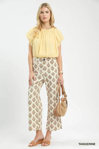 Women wearing floral pants.