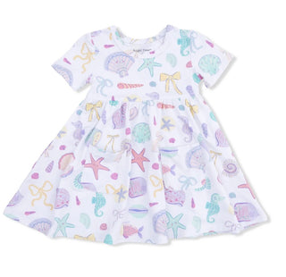 Children's dress with colorful sea-themed pattern on a white background