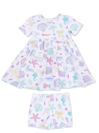 Children's dress and shorts set with pastel sea-themed print on a white background