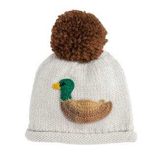 Knitted hat with brown pom-pom and duck design on a white background