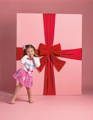 Girl posing with tutu on.