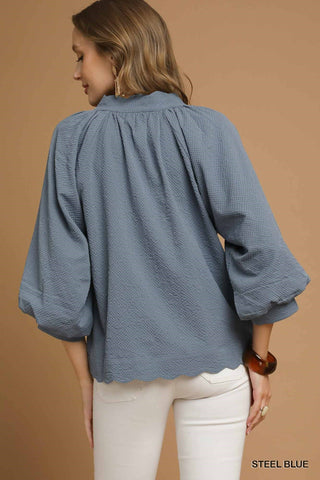 Back view woman in blue top