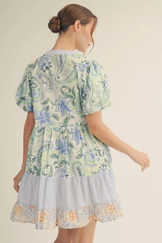 Woman wearing a floral dress with a white background