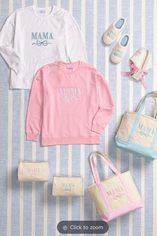 Pink 'MAMA' sweatshirt with matching accessories on a striped background