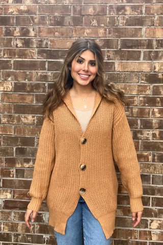 Girl wearing teddy bear cardigan front 