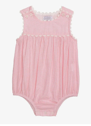 Pink baby romper with lace details on a white background