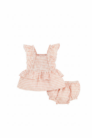 orange and white checkered baby romper with ruffled top and bloomers on a white background