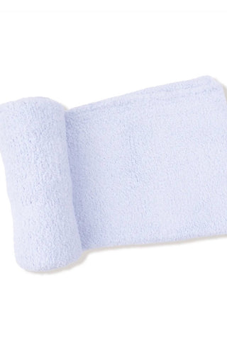 A light lavender-blue terry cloth towel, partially rolled, shown on a plain white background.