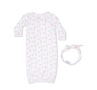 Baby gown with floral pattern and matching headband on a white background