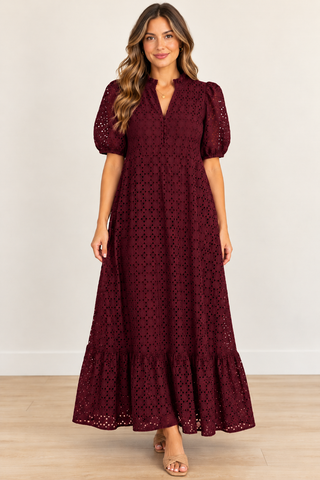 Women standing in a burgundy maxi dress