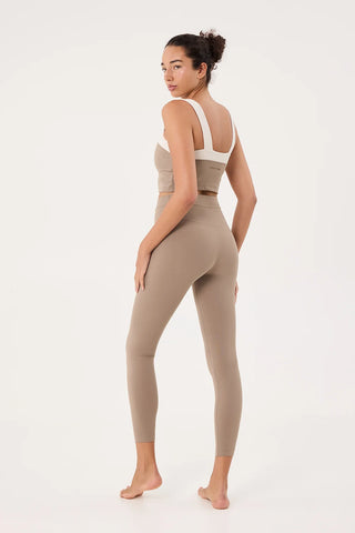 Back view of women wearing workout clothes. 
