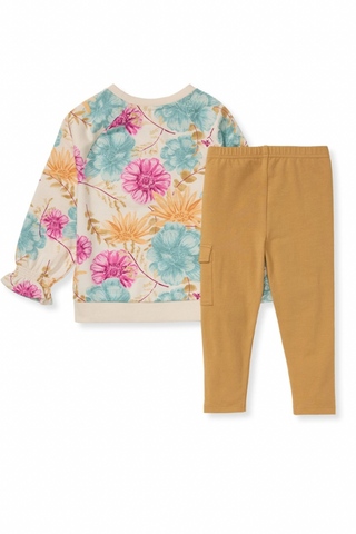 Floral sweatshirt and mustard pants on a white background