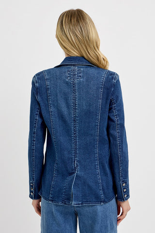 Person wearing a blue denim jacket on a white background
