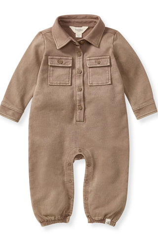 Brown baby romper with button details on a white background