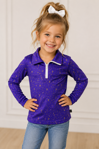 little girl wearing top.