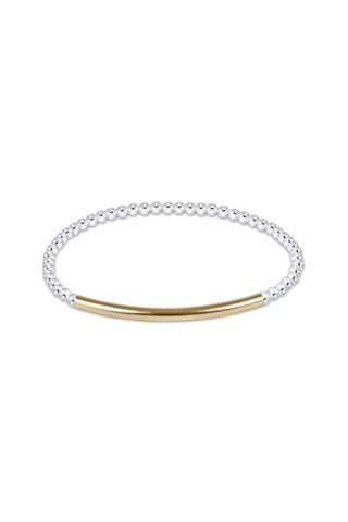 A minimalist two-tone bangle bracelet featuring a textured silver beaded band and a smooth gold bar clasp, shown on a plain white background.