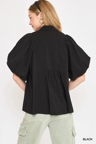 women standing with her back  showing the back view. 