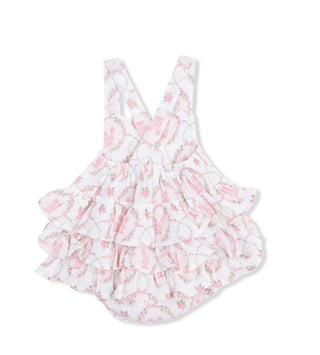 White swimsuit with pink floral pattern on a white background