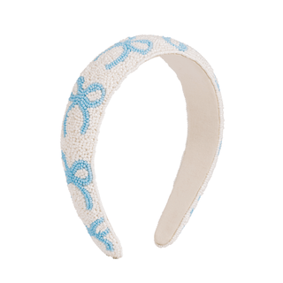 Beige headband with blue decorative elements on a white background