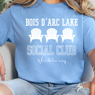Bois d’Arc Lake Social Club Tee On Light Blue Close Up