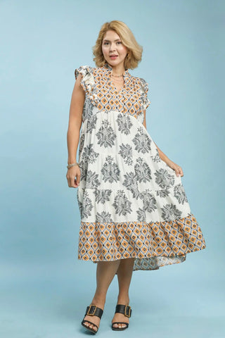 Woman wearing a floral dress on a light blue background