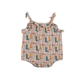 Baby romper with cowboy boot pattern on a white background