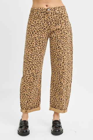 Leopard print pants worn by a person on a white background