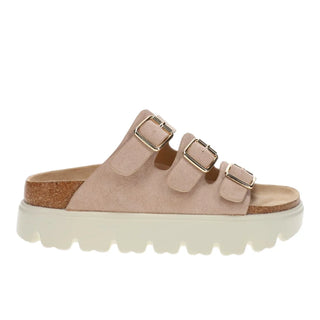 Beige sandal with multiple buckles on a white background