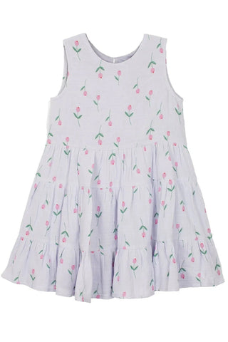 White dress with pink floral pattern on a white background