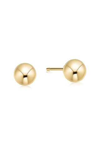 Pair of gold round stud earrings on a white background