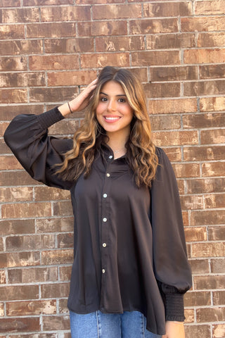 Girl wearing Breezy blouse. 