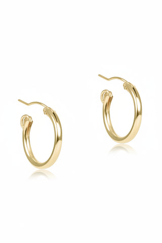 gold hoop earrings on a white background