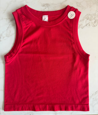 Red tank top on a light marble background