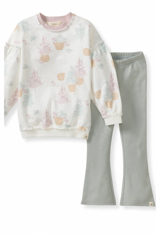 Children's pajama set with a patterned top and solid pants on a white background