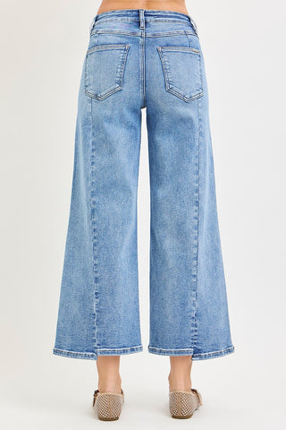 Light blue denim wide-leg jeans on a plain background