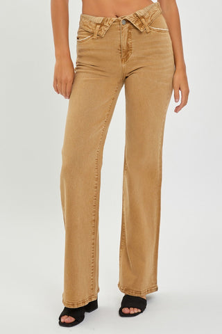 Tan high-waisted jeans worn by a person on a white background