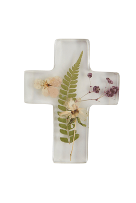 Decorative cross with pressed flowers and leaves on a white background